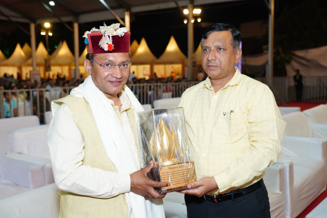 Information Director General Banshidhar Tiwari giving the honor